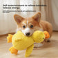 Corgi holding a yellow waffle textured plush duck toy in its mouth on a wooden floor with a self-entertainment caption