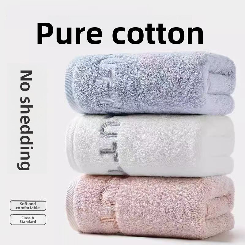 Pink and white cotton towels folded to show the thick quick drying pile