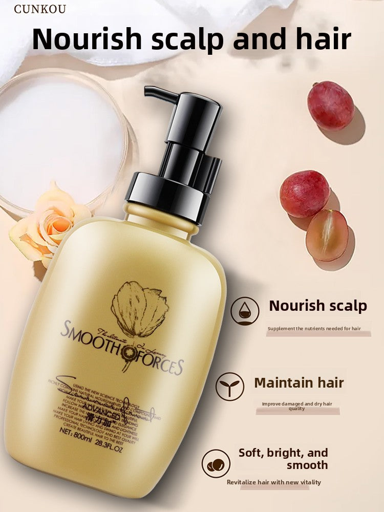 Gold pump bottle of the conditioning hair mask beside grapes and a rose with nourish callouts