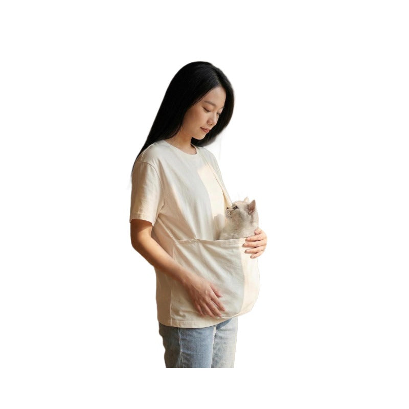 Front view of the natural white cotton pet pouch t-shirt worn at home