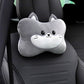 Gray cat headrest pillow with a white muzzle shown alone on a black car seat