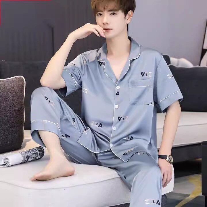 Man checking phone while wearing the pajamas