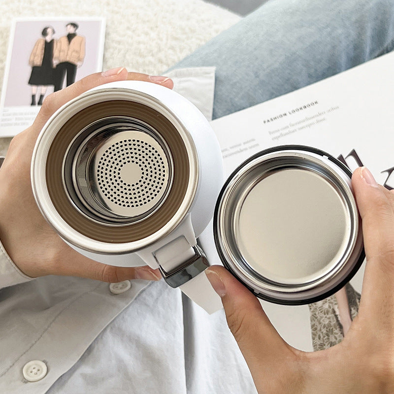 Looking down into a white flask with the perforated tea strainer seated in the neck