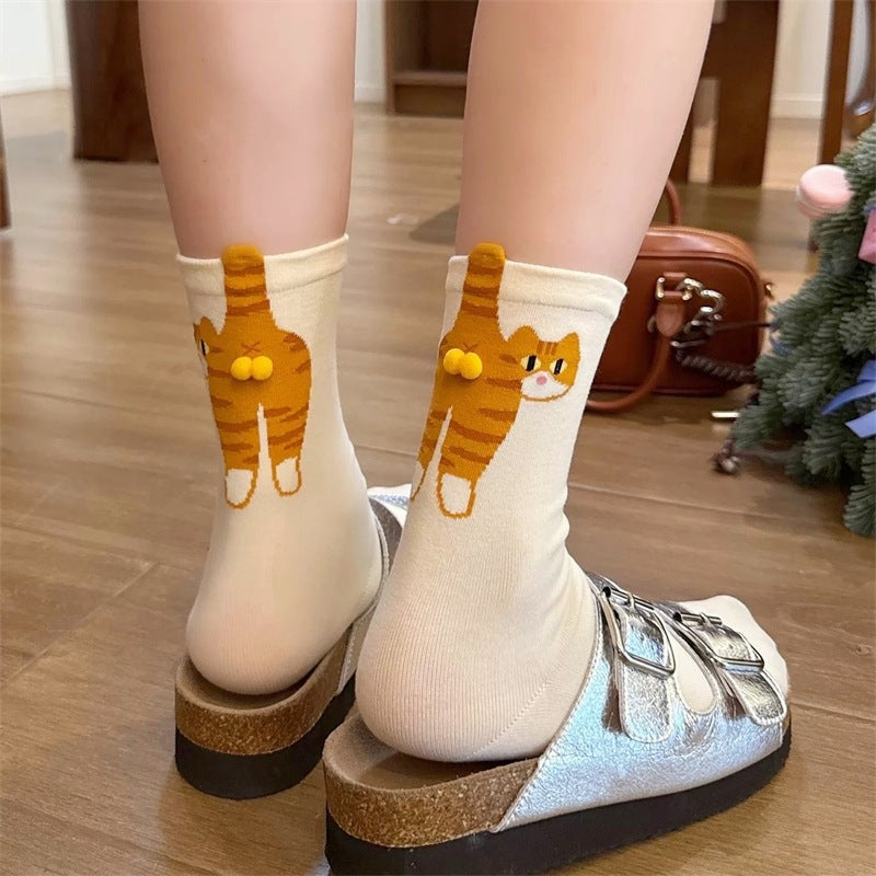 Back view of the cartoon cat design climbing the leg of the crew sock