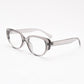 Transparent grey oval cat eye TR90 frame with clear lenses at an angle