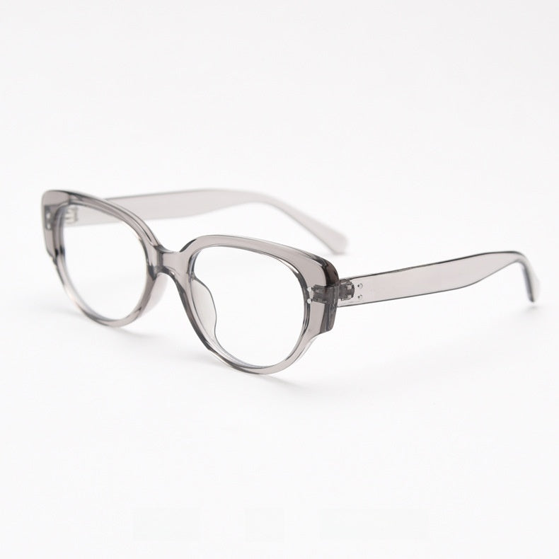 Transparent grey oval cat eye TR90 frame with clear lenses at an angle