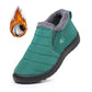 Warm plush lined slip on snow boot with a round toe and elastic side panel
