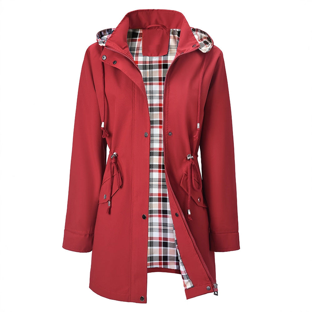 Red women's hooded windbreaker with a tartan lining shown open at the front