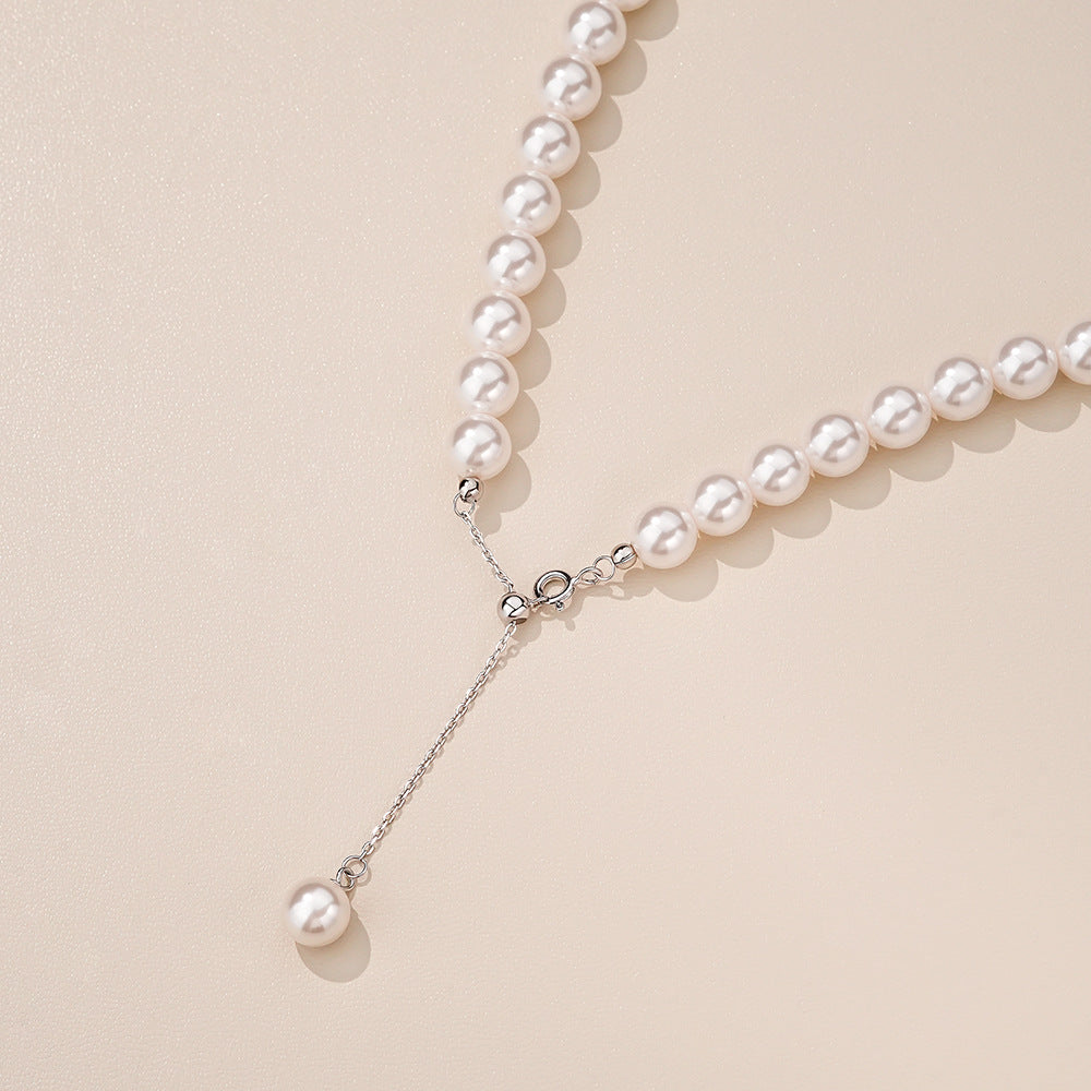 Close-up of the polished S925 sterling silver round bead and white gold tone chain links