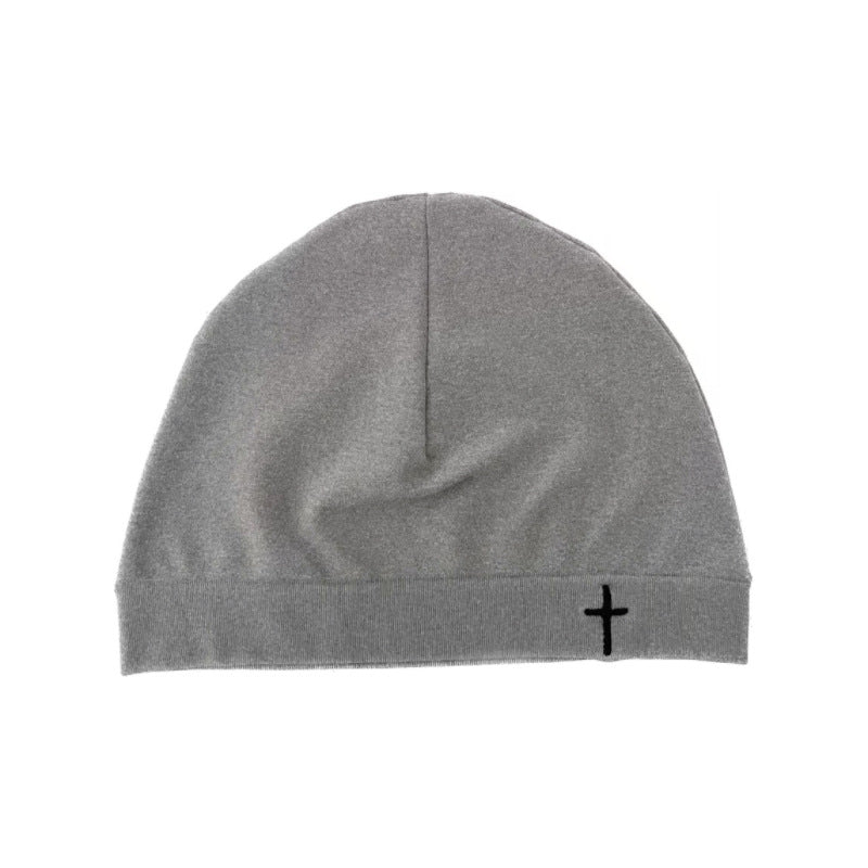 Cross embroidered beanie in a smooth lightweight polyamide nylon knit with a folded cuff