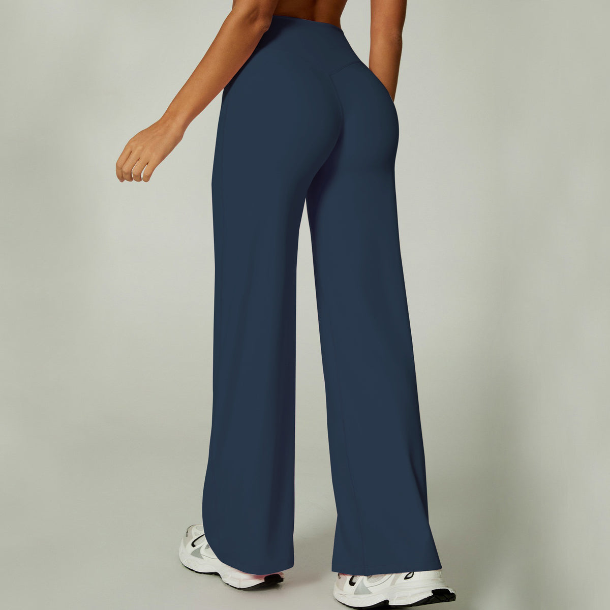 Full length wide leg stretch pants worn with sneakers