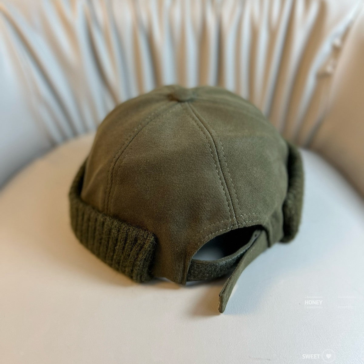 Brimless docker beanie with a six panel washed crown in olive green