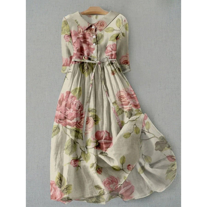 Painterly floral midi dress with a buttoned placket and self tie waist on a hanger