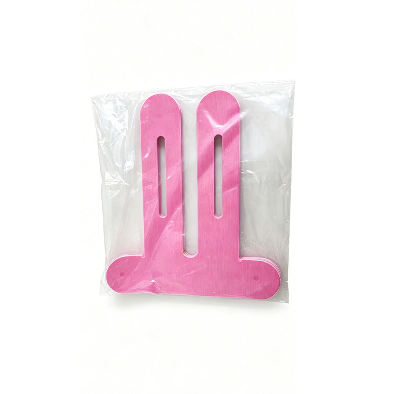 Pink pre-cut knee tape piece sealed in a clear polybag