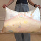 Zero-G goldfish girl silk pillowcase held open, showing a girl riding a goldfish