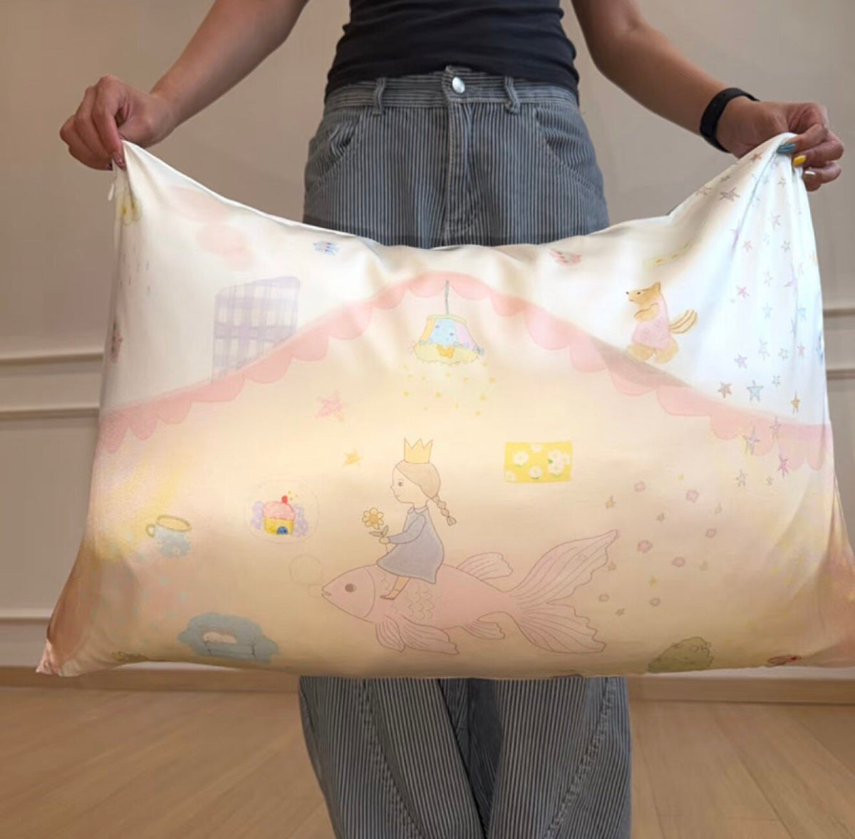 Zero-G goldfish girl silk pillowcase held open, showing a girl riding a goldfish