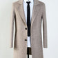 Flat top-down shot of the herringbone wool blend overcoat