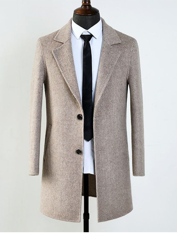 Flat top-down shot of the herringbone wool blend overcoat