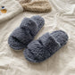 Curly teddy plush open toe house slipper shown as a studio product photo