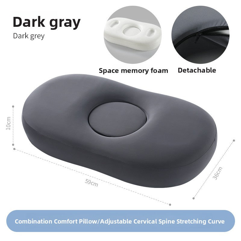 Dark gray oval memory foam pillow marked 59 by 36 by 10 centimeters on white