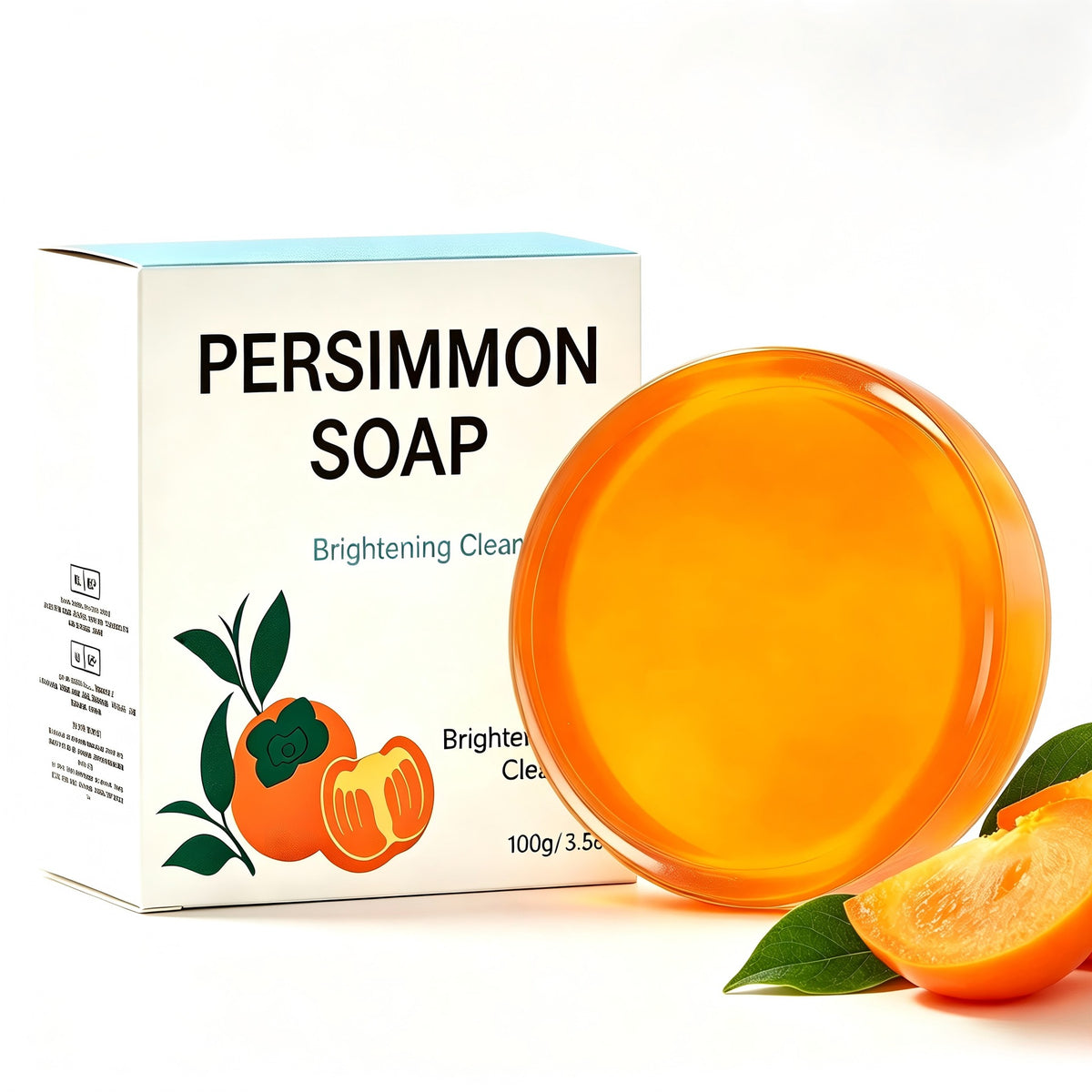 Amber persimmon soap bar and a Persimmon Soap box beside a persimmon wedge and green leaves on white