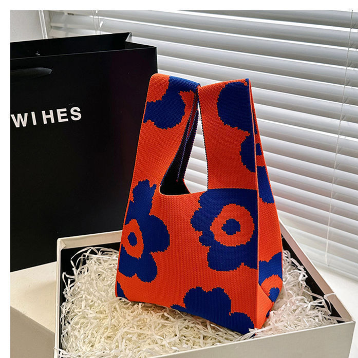 Knitted polyester handbag with an open top and a two tone jacquard motif
