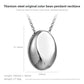 Drop pendant necklace on soft lit surface showing tone finish