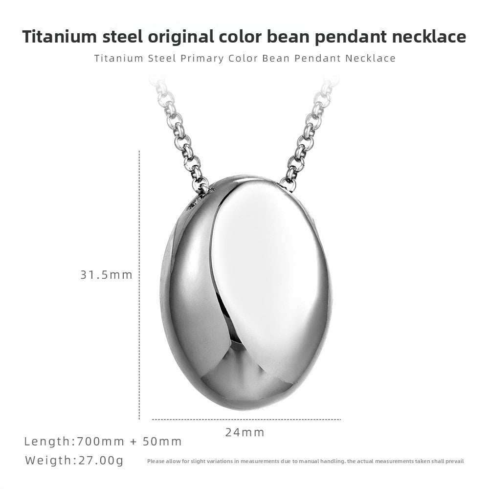 Drop pendant necklace on soft lit surface showing tone finish