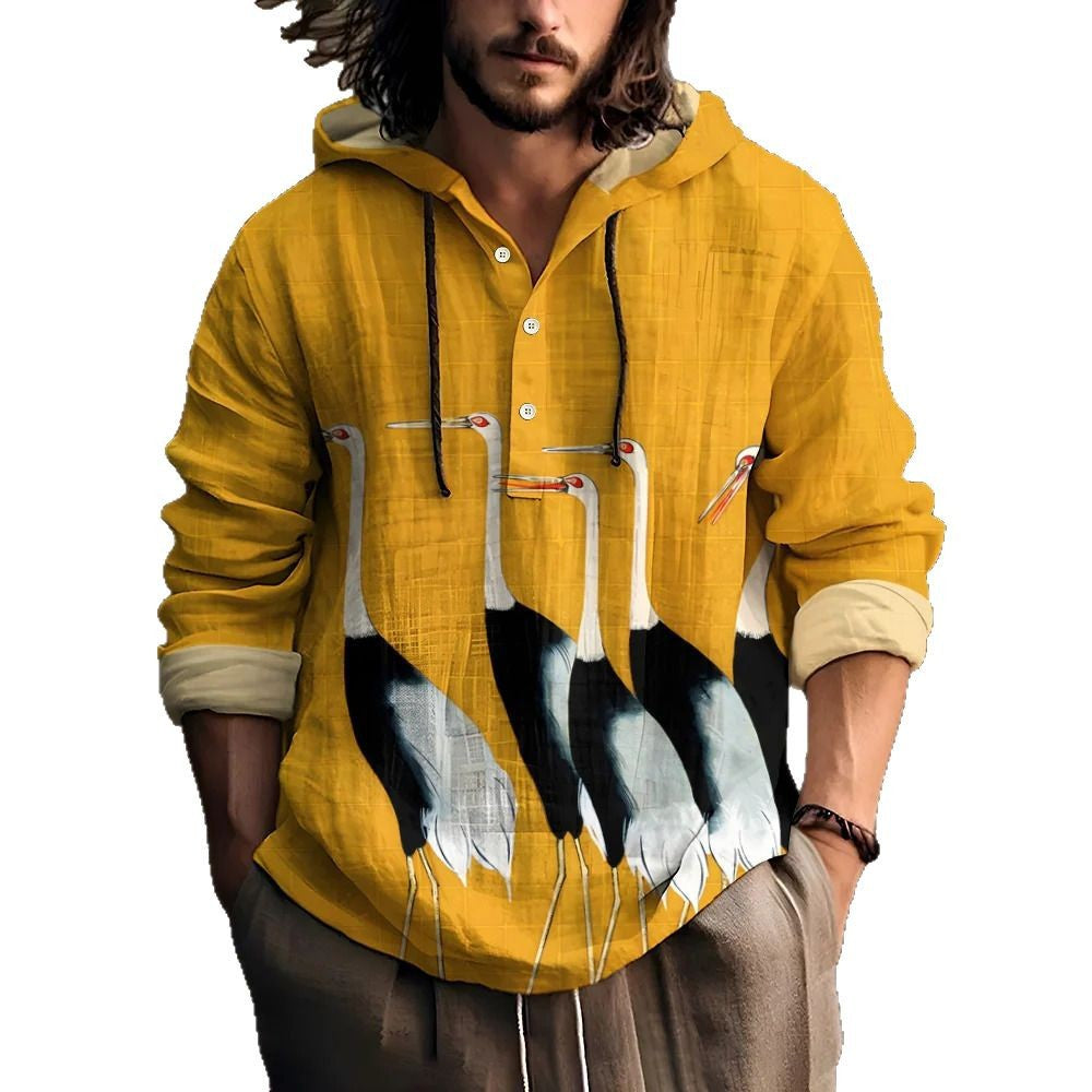 Man wearing a mustard yellow hooded henley shirt with a row of cranes print