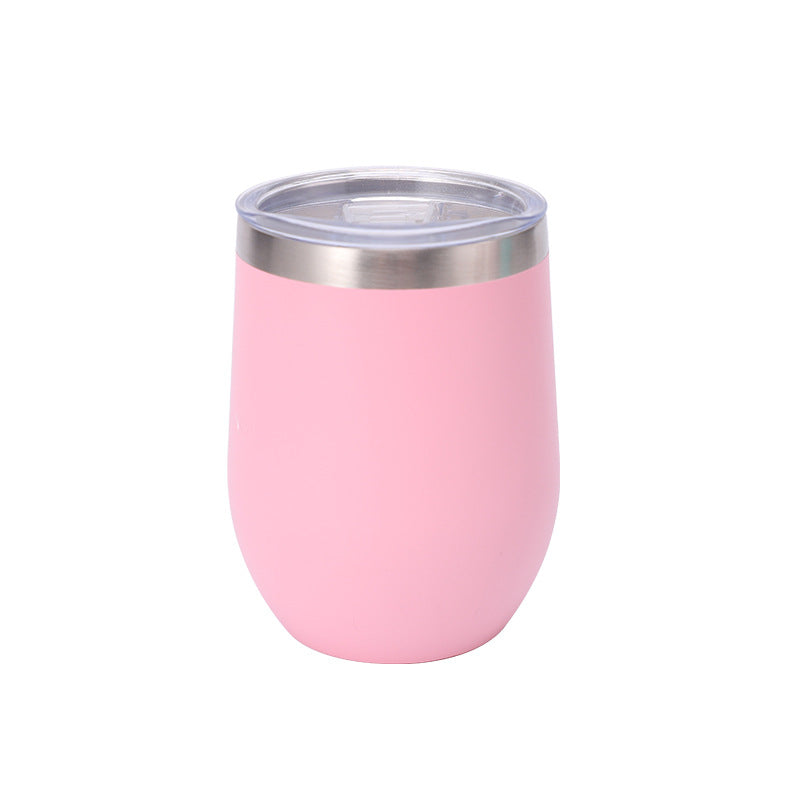 Light pink stemless insulated stainless steel tumbler with a clear press-on lid and an exposed steel rim