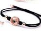 Couple bracelets set held in hand for wrist size and scale reference