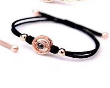 Couple bracelets set held in hand for wrist size and scale reference