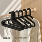 Black Adult Hanger on a wooden rail beside a white garment, 23.7 x 41 x 2 cm