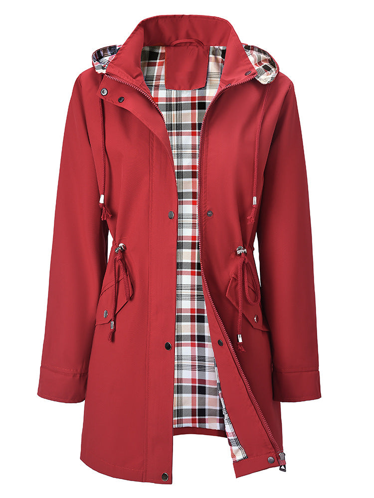 Red women's hooded windbreaker shown from the back full length