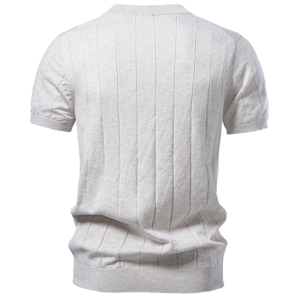 Close-up of the fine flat-gauge cotton knit texture and ribbed cuff detail