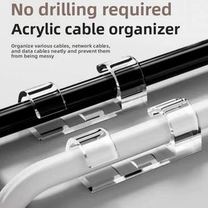 Clear acrylic self adhesive cable clips holding cables neatly along a surface