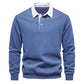 Top down clean shot of the polo collar pullover on a light background