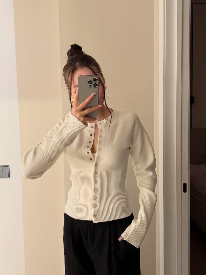 Brown rib knit cardigan buttoned down the front with a defined waist