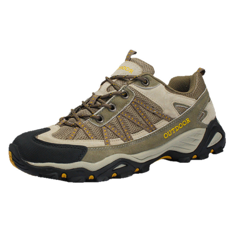 Suede and mesh hiking shoe worn outdoors on rocky ground with laces snugged