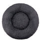Dark gray round plush pet bed with a raised bolster rim on a plain background