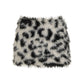 Black and white spotted vegan fur mini skirt laid flat on a white background, size L option