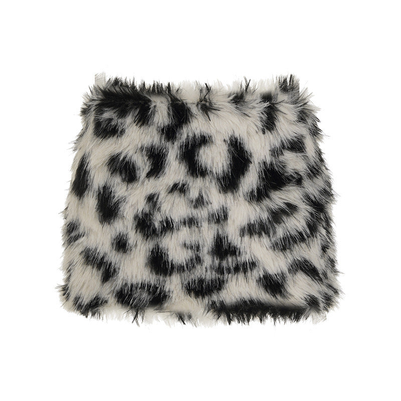 Black and white spotted vegan fur mini skirt laid flat on a white background, size L option