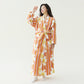 Sunflower Print with Pants set, orange striped fleece robe with white flowers, worn by a model