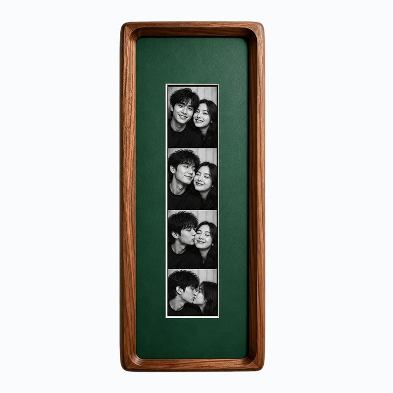 Black walnut photo strip frame with vintage green lining and an acrylic front, shown with four photos