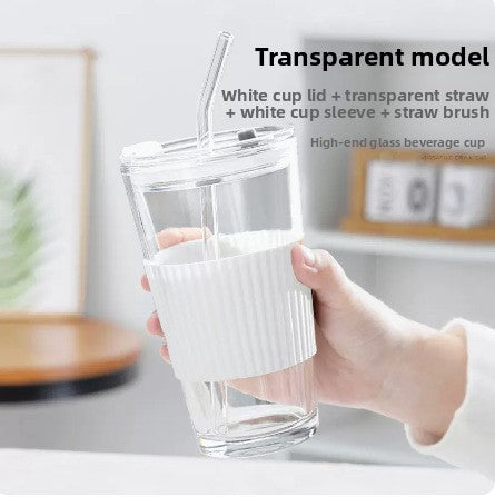 Glass straw cup with lid for coffee and beverages | scale reference next to a hand