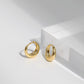 Single hoop held between two fingers for diameter size reference