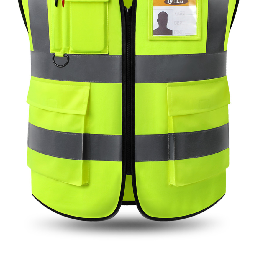 Close up of a fluorescent yellow work vest with ID window pocket, D-ring, flap pockets and center zip