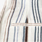 Back detail of striped pants showing welt pocket and vertical stripe pattern