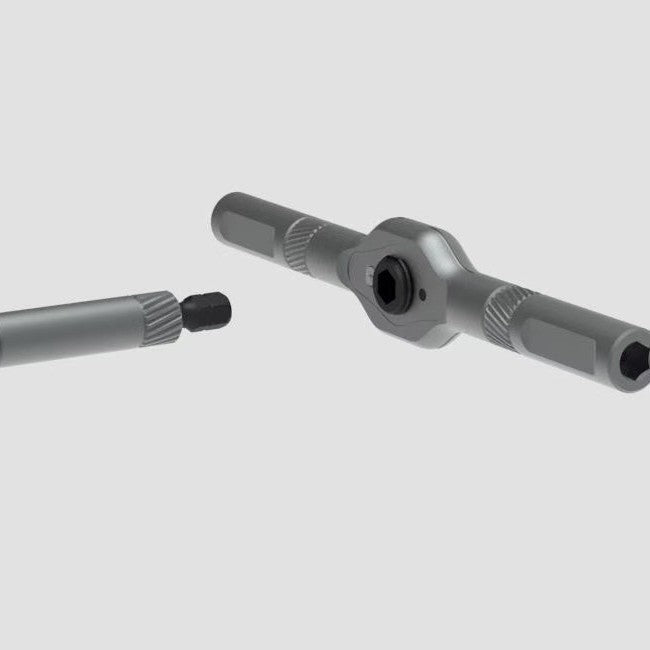 T bar ratchet handle and magnetic bit extension shown apart on a plain grey background