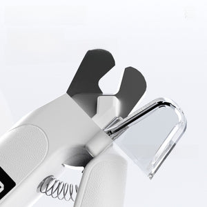 White pet nail clipper open blades with clear guard and coil spring shown in closeup